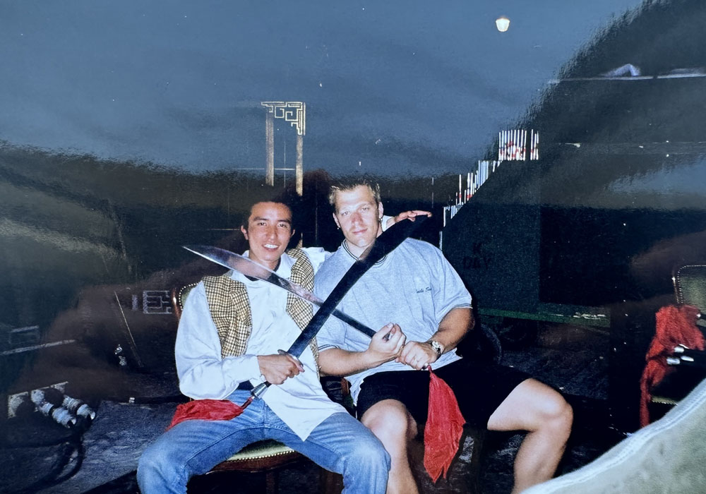 Jackie Chan's double Ramazan Amirgaliyev on set of SHANGHAI KNIGHTS with a crew member